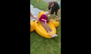 Elderly woman enjoys tube slide for Senior Heath and Wellness Day