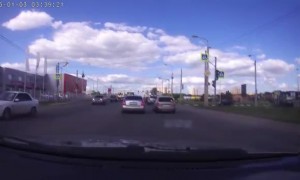 Turning Semi Truck Tips and Slides Across Street