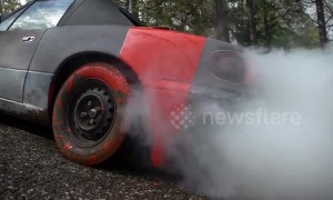 US car bursts into smoke after red paint is poured into fuel tank
