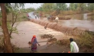 Intense moment as motorcyclist gets swept away by flooded road in India