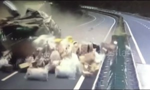 Loaded goods scatter across Chinese motorway after huge truck collision