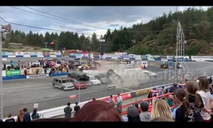 Car stunt man crashes into a high stack of cars