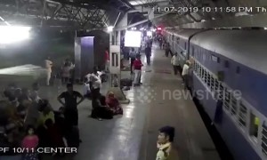Commuters rush to save woman from being run over by train in western India