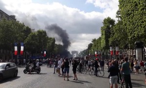 French riot police use tear gas to disperse Bastille Day protesters
