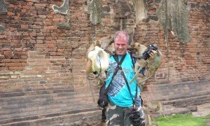 Monkey business as horde of simians swarm photographer in Thailand