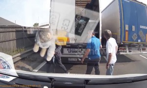 Truck on UK motorway stops to unload migrant workers