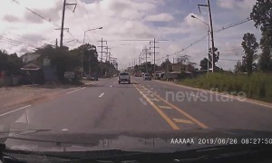 Truck in Thailand tries to cut off other drivers but immediately flips over and crashes