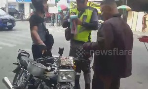 Wrong place! Motorcyclist fined after being caught wearing RICE POT as a helmet