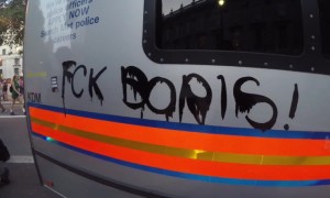 Police cars vandalised as they hold out against anti-Boris Johnson protest in London