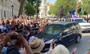 Boris Johnson greeted by a mix of cheers and jeers at Downing Street after being announced as Prime Minister