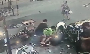 Concrete block hits woman with baby in arms after falling from building in China