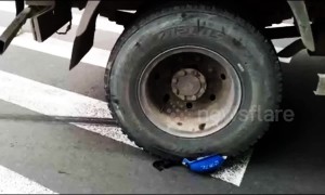 Helmet saves scooter driver’s life after his head is run over by truck in China