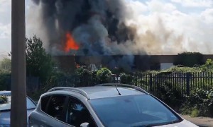 Building catches on fire, creates massive flames