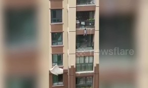 Kind-hearted people use duvets to catch boy falling from fifth-floor balcony in China