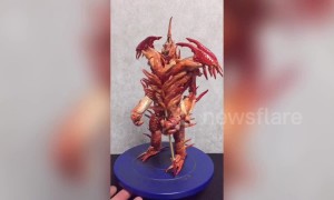 Creative man in China uses crayfish shells to build dinosaur-like sculptures