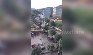 Coal factory and streets submerged after nearby dam collapses in northern China