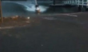 Jet Ski Slides Along Car Park
