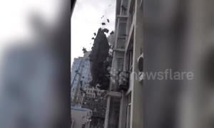 Cluster of tiles slide off roof of six-storey building in China's Dalian