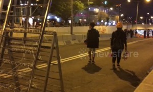 Protestors block main road in Kowloon, Hong Kong
