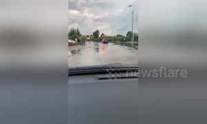 Cars plough through submerged Nottingham road after flooding