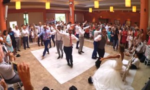 Bride surprised with dance led by groom and his groomsmen