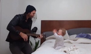 When dad begins to play guitar, this baby has the best reaction ever