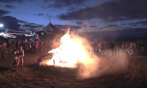 Spectacular footage of Spain's Motorbeach festival sees motorbikes ride around a huge bonfire