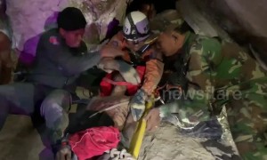 Cambodian man rescued after spending four days wedged between rocks in a cave