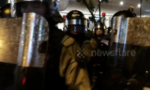Riot police use pepper spray against protesters in Hong Kong