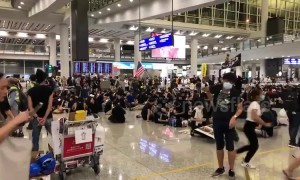 Protesters occupy Hong Kong International Airport cancelling all departure flights