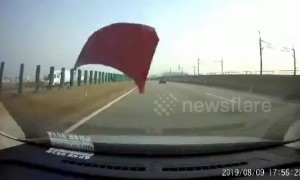 Bonnet smashes car window after being blown off by strong winds in China