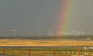 Plane lands at German airport with a stunning rainbow backdrop