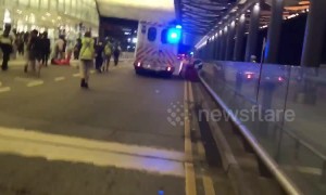 Hong Kong police chase after protesters following police vehicle vandalization at airport