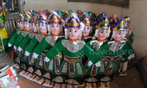 A creepy village specializes in producing paper effigies for the dead