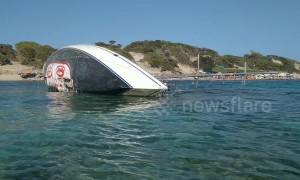 Shipwrecked yacht winds up on Ibiza beach with ecology message