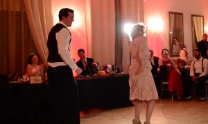 Groom and his mom pull off awesome mashup dance