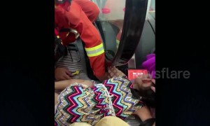 Five-year-old girl gets her arm stuck in escalator handrail at a mall in China
