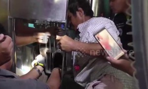 Thai worker rescued after getting hand stuck in water bottling machine