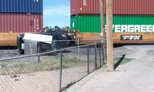 Train Takes out Car Carrier