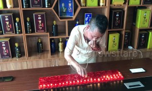 Kung fu master blows out 120 candles using EARS