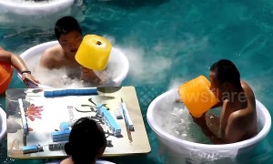 Chongqing residents enjoy giant 5 kg ice lollies to stay cool during heatwave