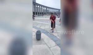 Elderly Chinese man spins 15 kg gas canister using a drill
