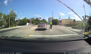 Car Nearly Clipped by Passing Train
