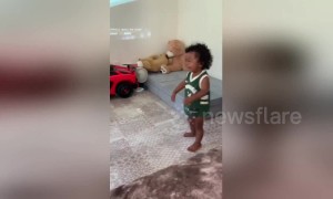 LeBaby James! Adorable little boy is a ferocious dunker to dad's delight