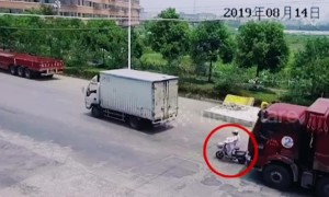 Scooter rider narrowly avoids being run over by truck in China