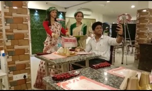 Robot waitress greets and serves customers at Indian restaurant