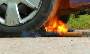 Incredible experiment as car tire takes on burning HOT axe