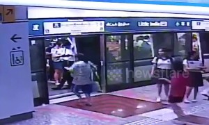 Woman in Singapore narrowly misses train then opens safety doors with her bare hands to climb inside