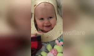 Adorable Michigan baby has burrito shell around head