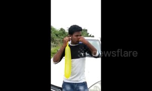 Indian man inflates 80cm balloon with his ear in bizarre feat
